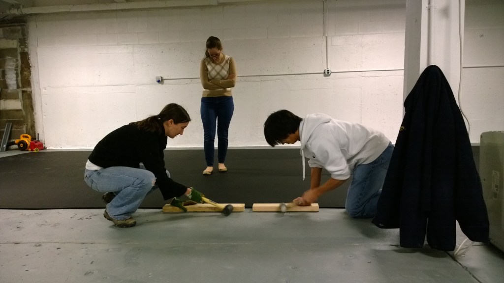 Sarah and Arthur adjust 3rd piece of floor.