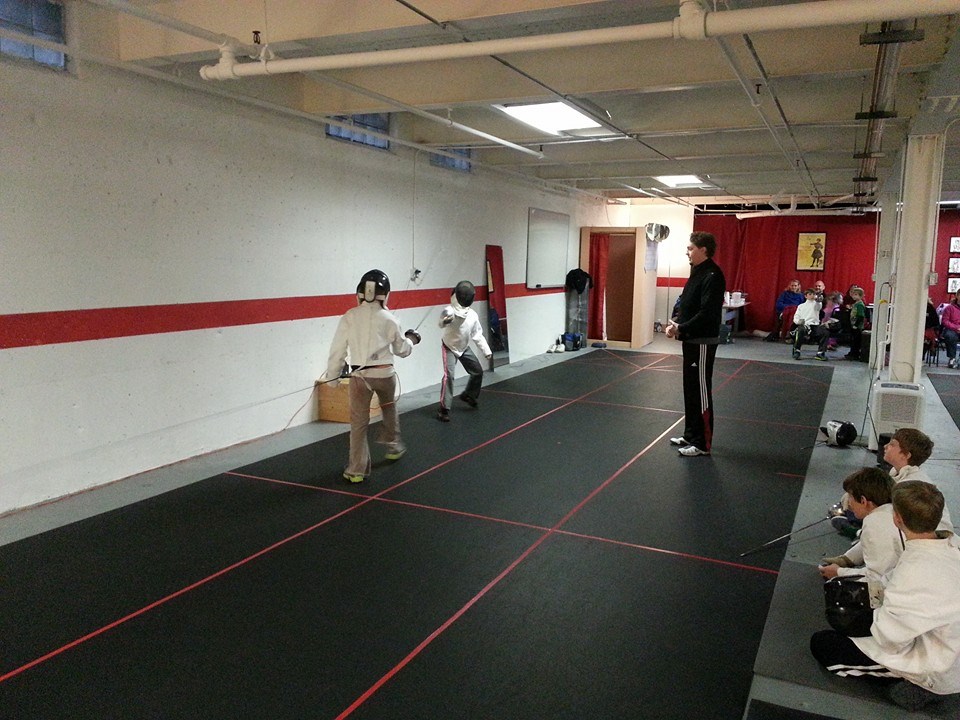 Kevin referees the girls' first ever fencing bout.