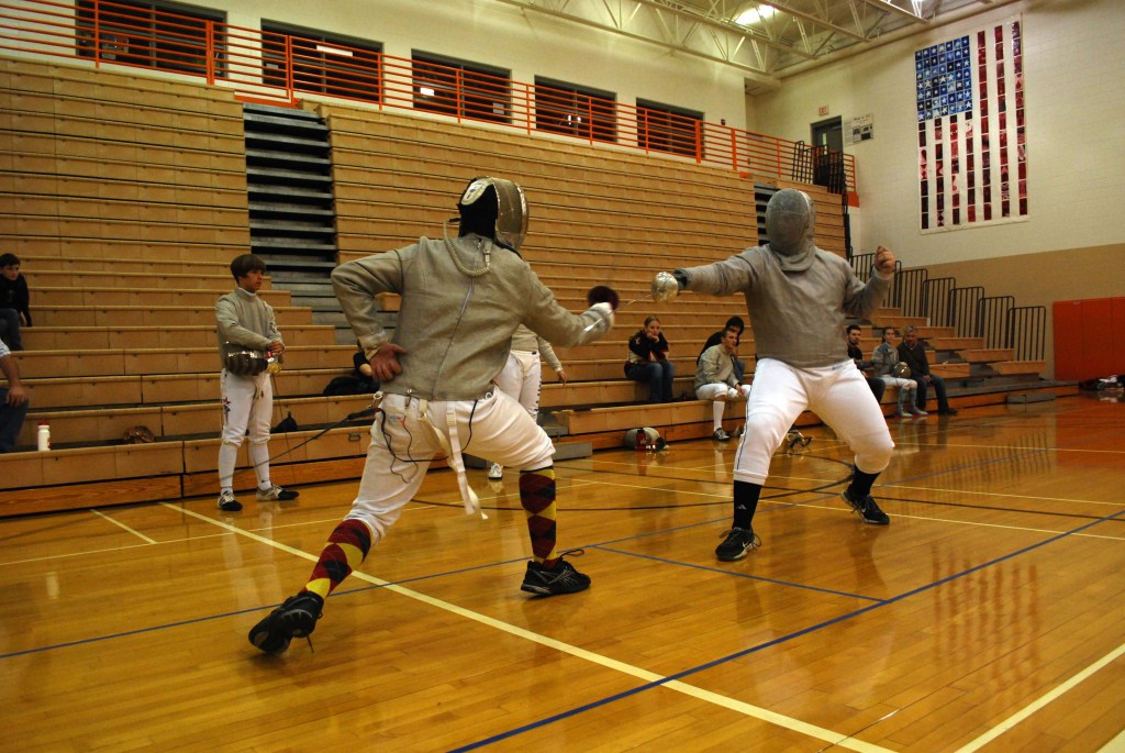 RDF fencer Shelton goes for a counterattack in the saber event
