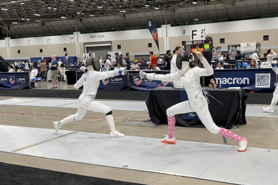 Kalina lunges and scores on an opponent who attempts to counterattack